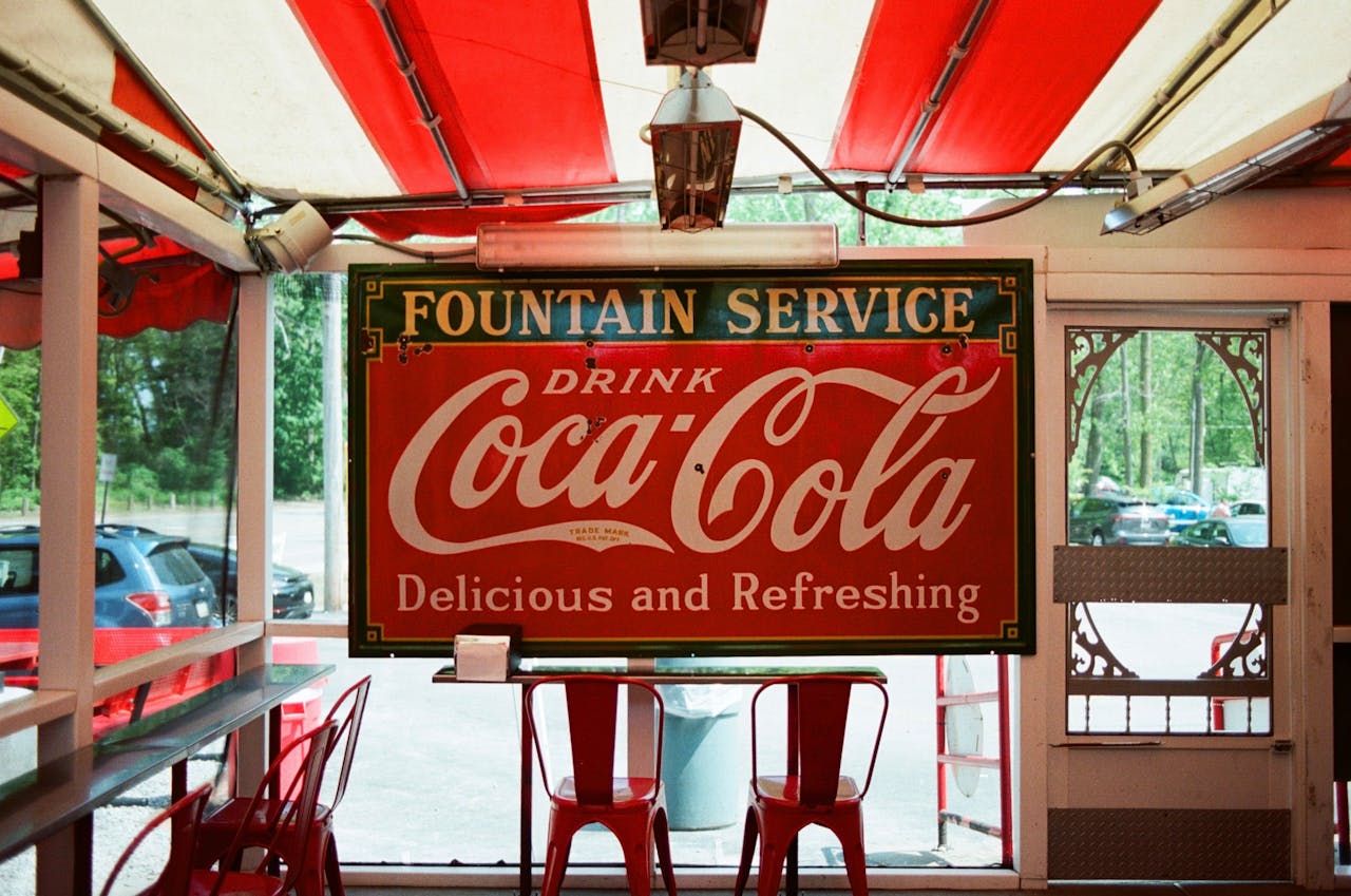 A sign for fountain service coca cola in a restaurant